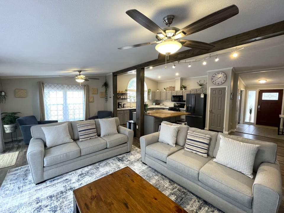 Living Room with Cozy Seating, Queen Sofa Sleeper, TV & Fireplace