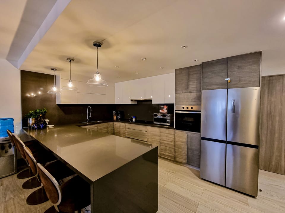 Luxury Condo, 3 Bedrooms, Beach View | Private kitchen | Full-size fridge, dishwasher