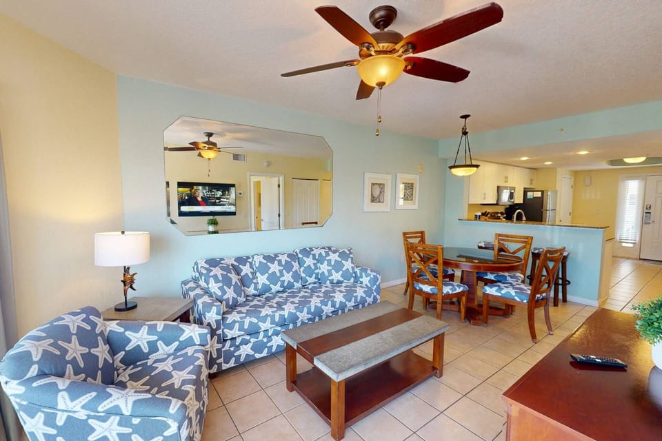 omfortable Living Room Area with Direct Balcony Access and a Queen Sleeper Sofa for Extra Guests
