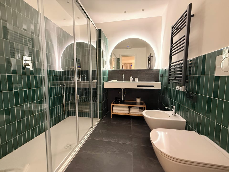 Superior Room | Bathroom | Designer toiletries, hair dryer, bidet, towels