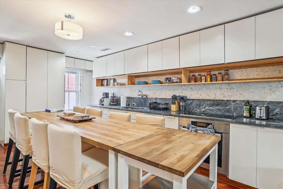 This open kitchen allows you the ability to cook meals or just sit around the spacious dining table that accommodates up to 8 people. 