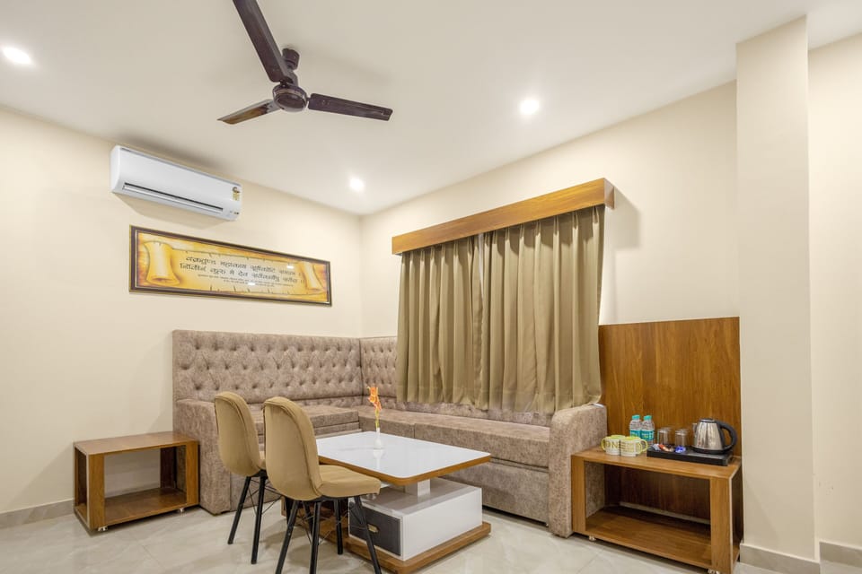 Luxury Quadruple Room, 1 Bedroom | Living area | 32-inch LED TV with satellite channels