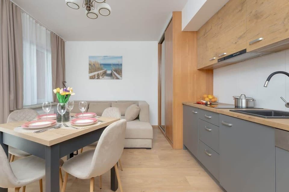 Living room with dining area and kitchenette.