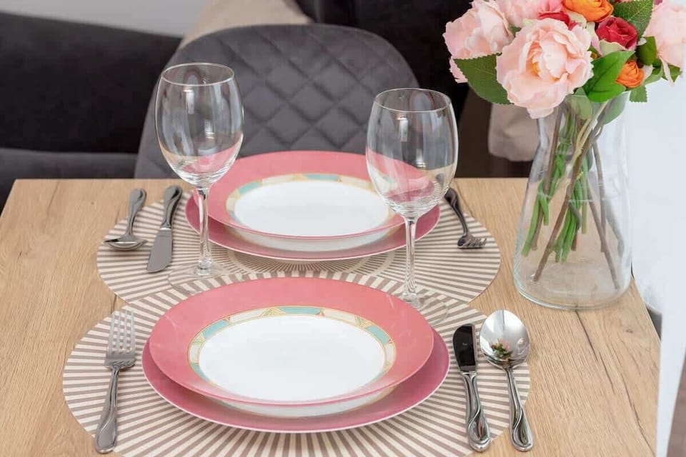 Dining table with tableware.