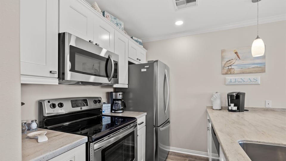 Kitchen with full size stainless appliances.