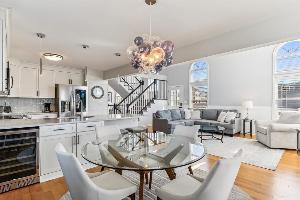 Step into your bright, open-concept space where elegant design meets everyday comfort. Sunlight pours through arched windows, inviting you to relax in style.