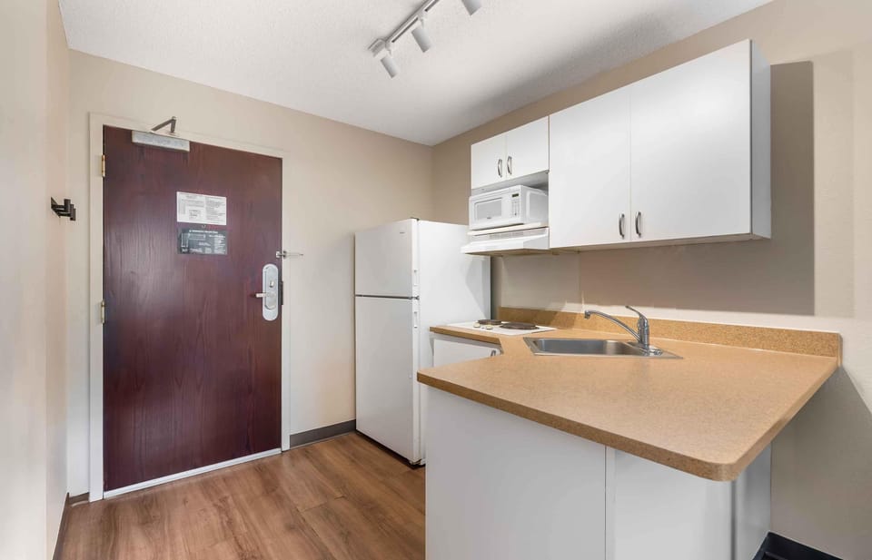 Studio, 1 Queen Bed, Non Smoking | Private kitchen | Full-size fridge, microwave, stovetop, coffee/tea maker