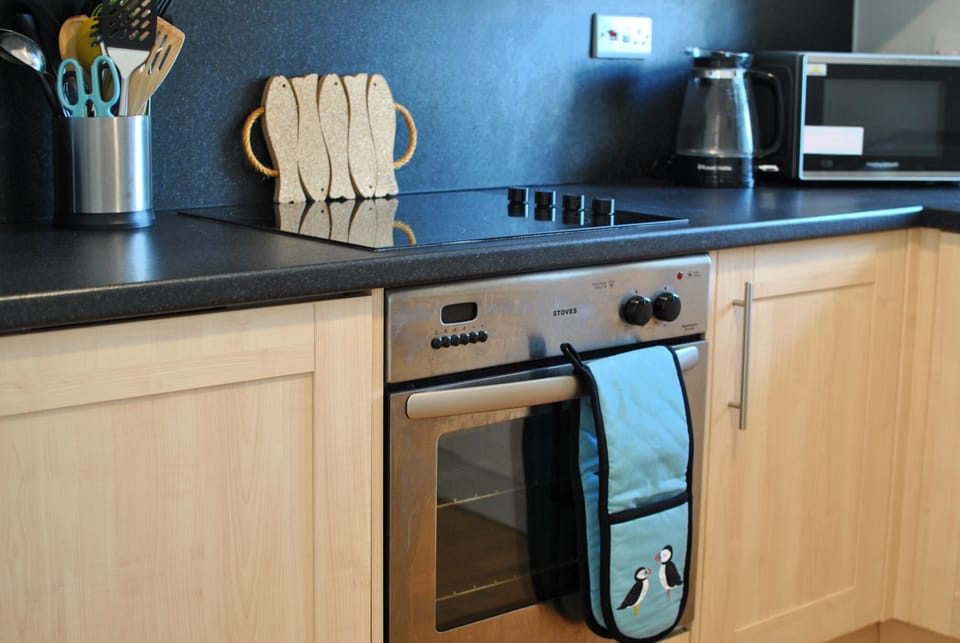 The kitchen is modern has plenty space to cook