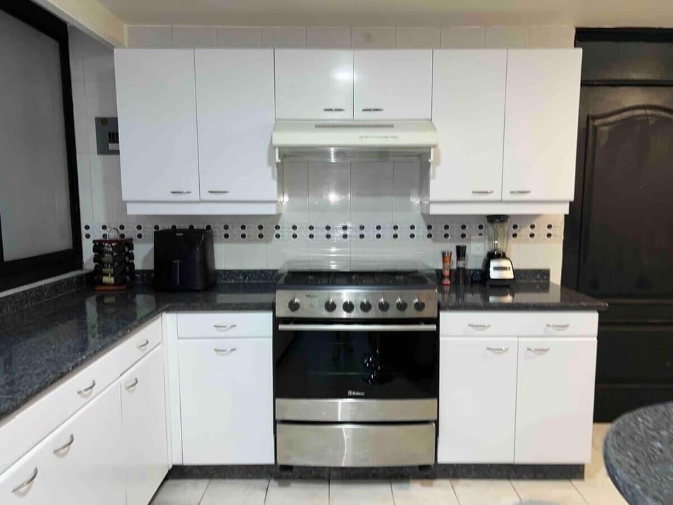 Cook like at home in a fully equipped kitchen with modern appliances and plenty of counter space.