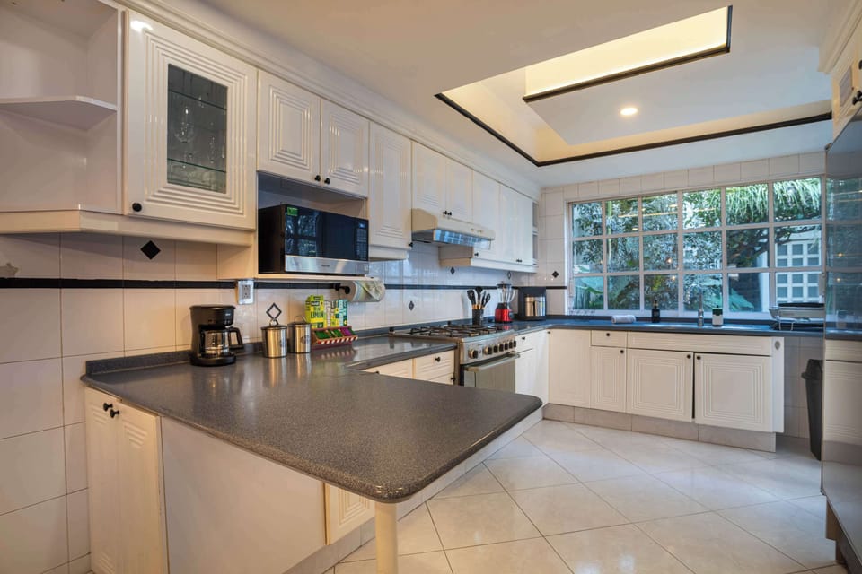 A well-equipped kitchen featuring a breakfast bar.
