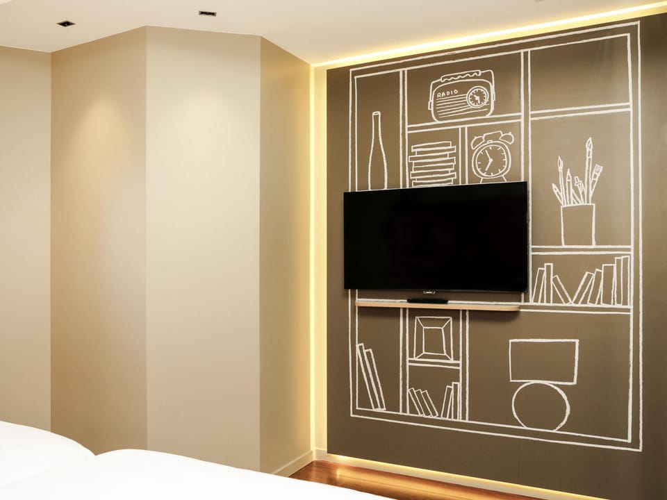 Premium bedding, desk, laptop workspace, blackout drapes