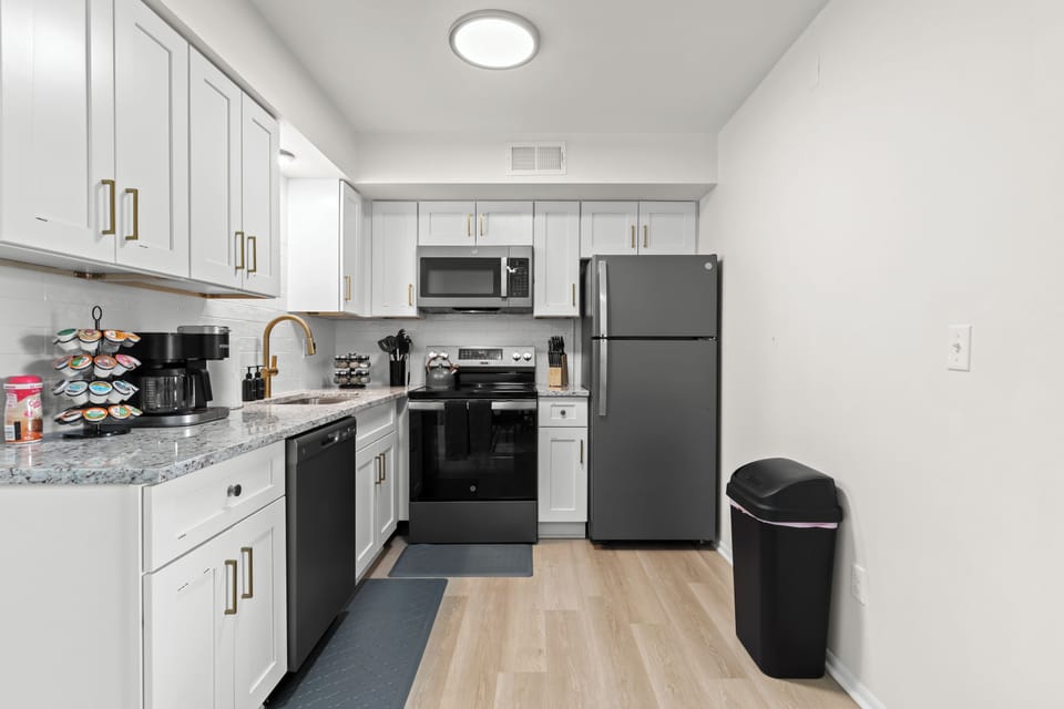 Modern kitchen with stainless steel appliances, quartz countertops, and everything you need for a home-cooked meal.