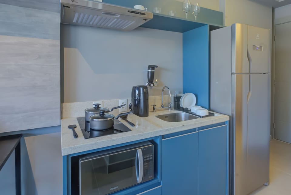 Fridge, microwave, stovetop, cookware/dishes/utensils