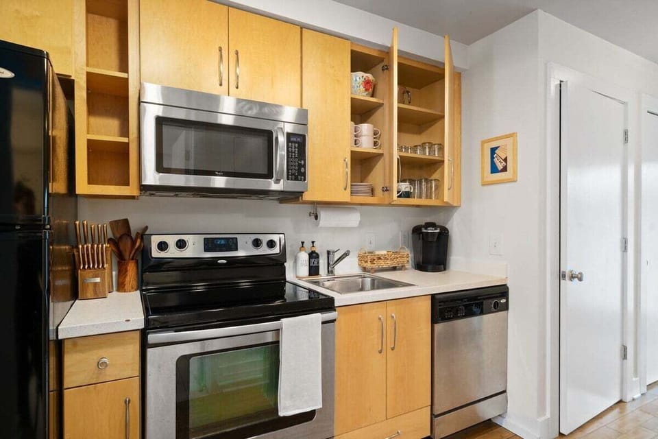 The fully stocked kitchen has everything you need from paper towels to a pizza cutter! 

Coffee and tea are provided for the Keurig.
There's also wine and shot glasses.