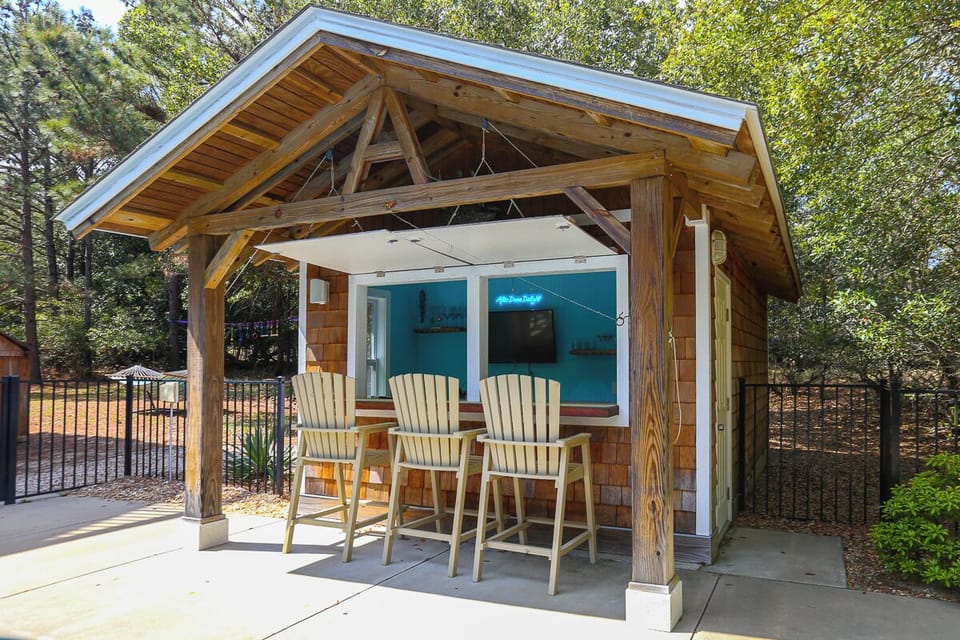 Tiki Bar with Flat Screen Television and Refrigerator 2025