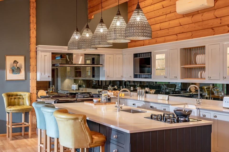 Spacious luxury kitchen with breakfast bar and pendant lighting at Valley View.