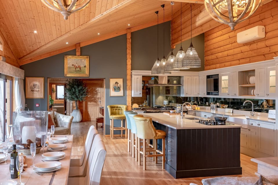 Spacious luxury kitchen with breakfast bar and pendant lighting at Valley View.