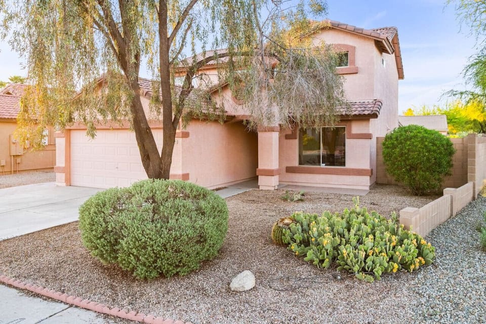 Welcome to your home away from home! This charming villa in Casa Grande offers a peaceful and inviting exterior, complete with desert landscaping and a cozy front porch.