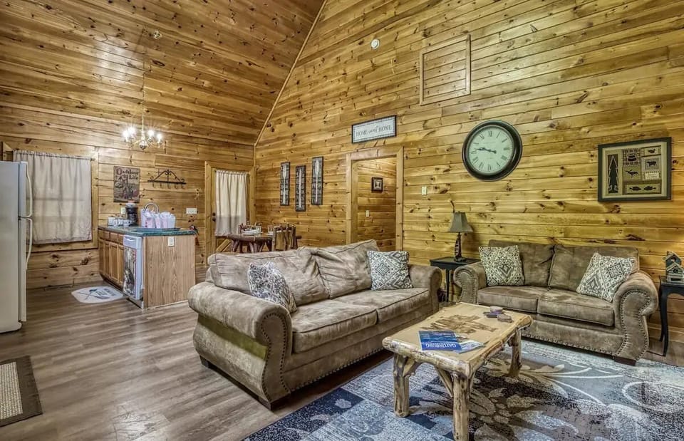 Living Room: Spacious and inviting with rustic charm, perfect for relaxing and unwinding together!