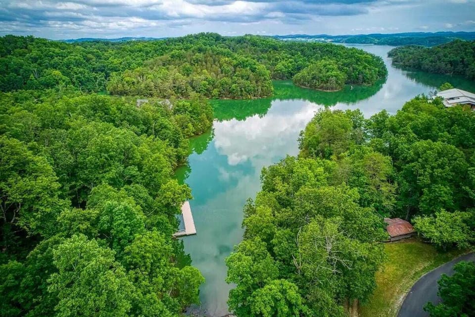 Breathtaking Lake View: Embrace nature's beauty with serene waters and lush greenery all around!