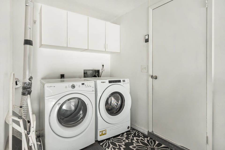 Garage space with a washer and dryer provided. Detergent is included! This is where we store all of the items such as pickleball net, basketballs etc....