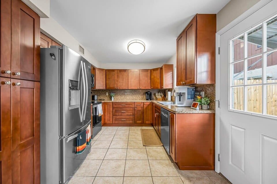 Modern kitchen with stainless steel appliances and ample wooden cabinetry