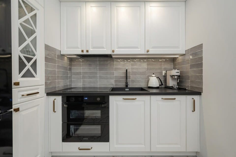 The fully equipped kitchenette includes everything you need for a home-cooked meal.