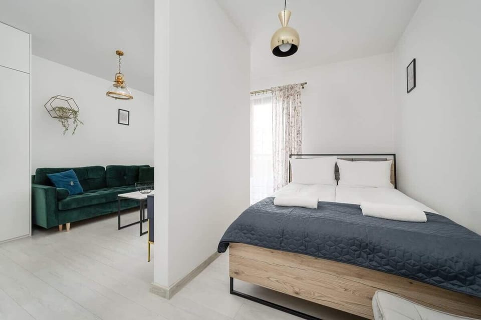 The living area's modern and stylish decor creates a welcoming atmosphere. 