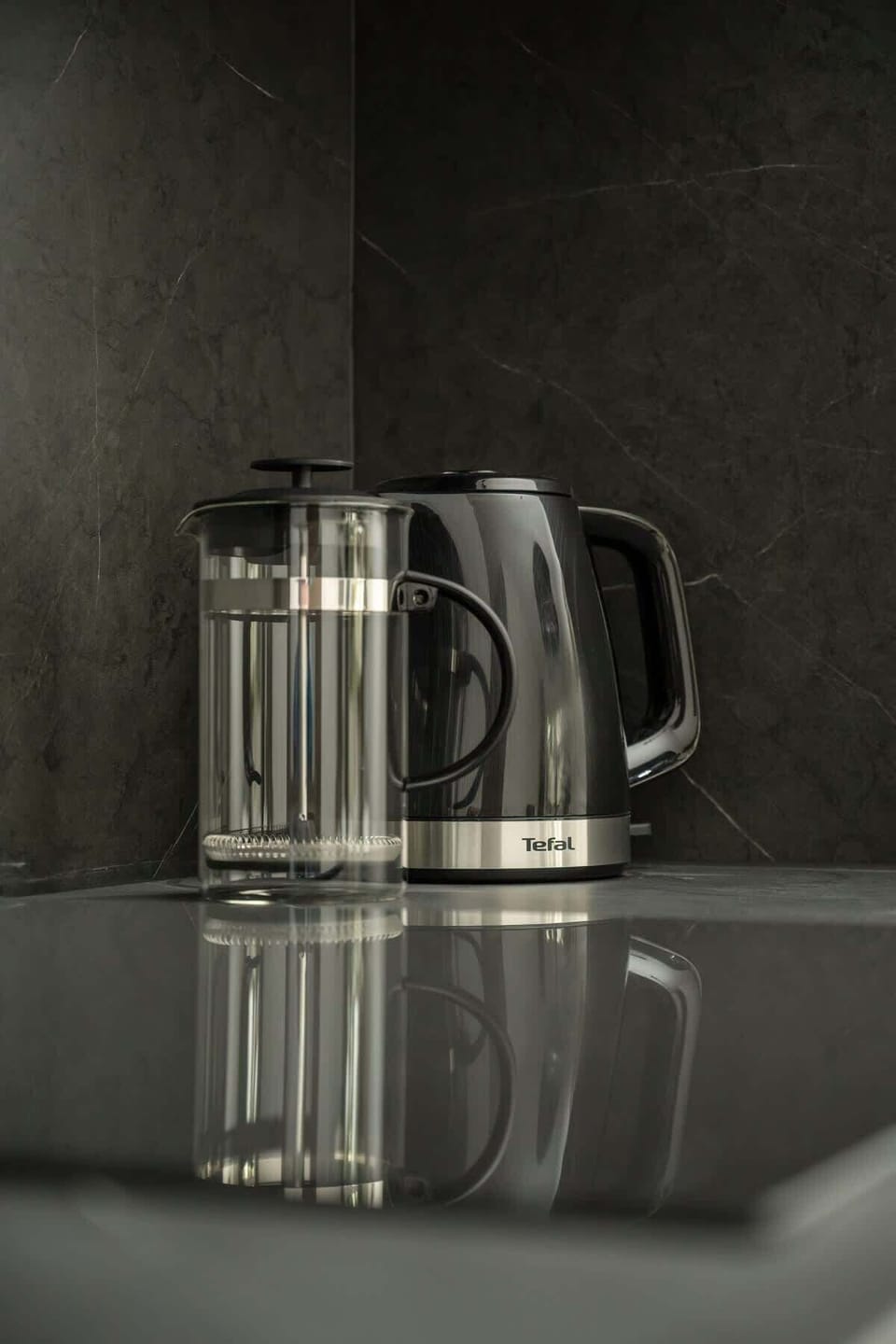 A close-up of a modern electric kettle in the kitchenette. Ready for your morning tea or coffee.