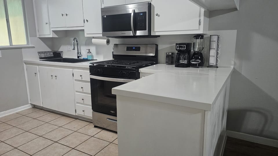 Prepare delicious meals in our kitchen, complete with modern appliances and ample counter space.