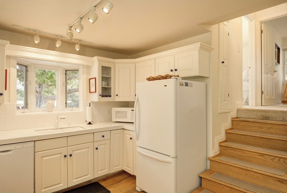 Fully Equipped Kitchen - Stairs Leading to the Bedrooms and Bath