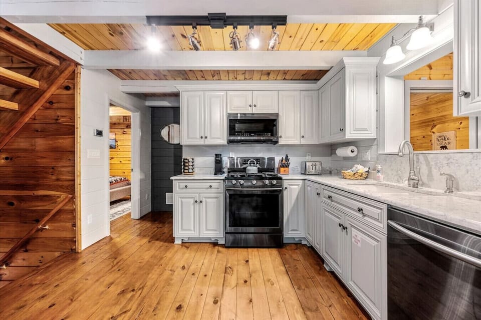 The kitchen includes all major appliances as well as silverware, cookware, dishware, utensils, a toaster, spices, and more.