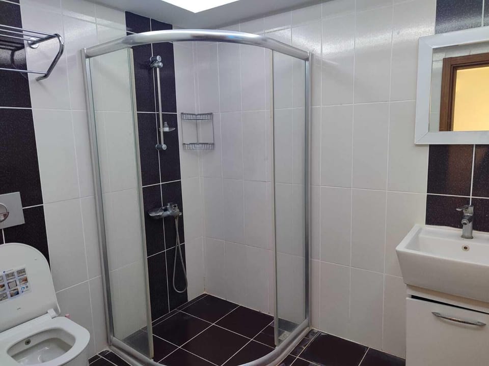 Rainfall showerhead, hair dryer, slippers, towels