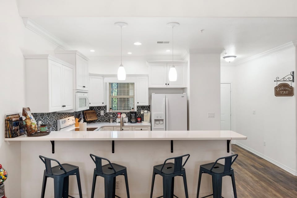 4 barstools offer additional seating!