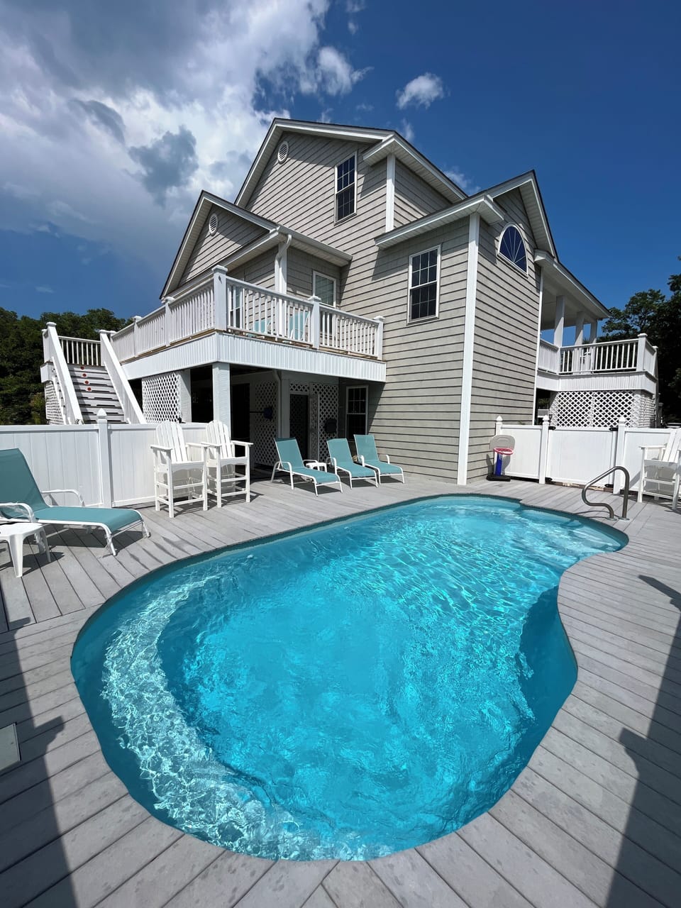 Back/side of house showing large saltwater pool