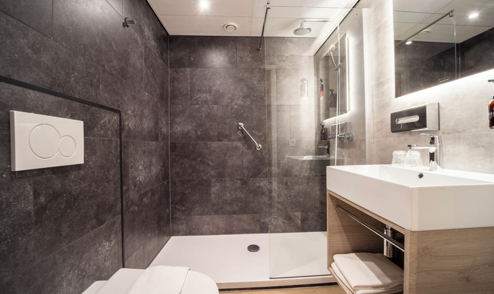 Shower, eco-friendly toiletries, hair dryer, towels