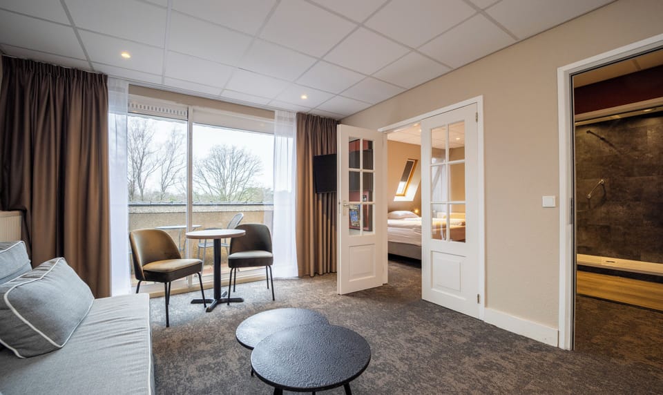 Junior Suite | Desk, blackout drapes, iron/ironing board, cribs/infant beds