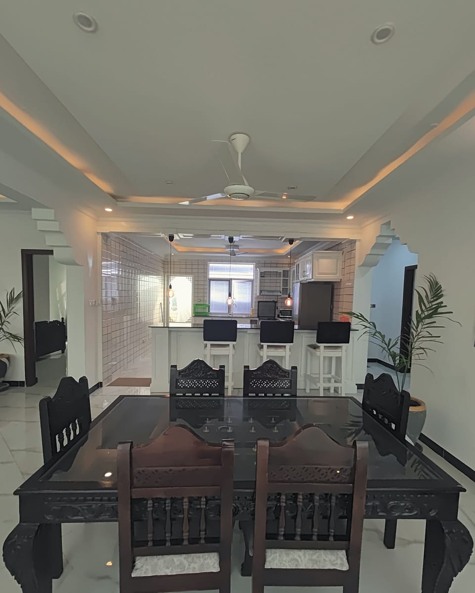 Deluxe Apartment, 3 Bedrooms, City View | Living area | 60-inch Smart TV with digital channels