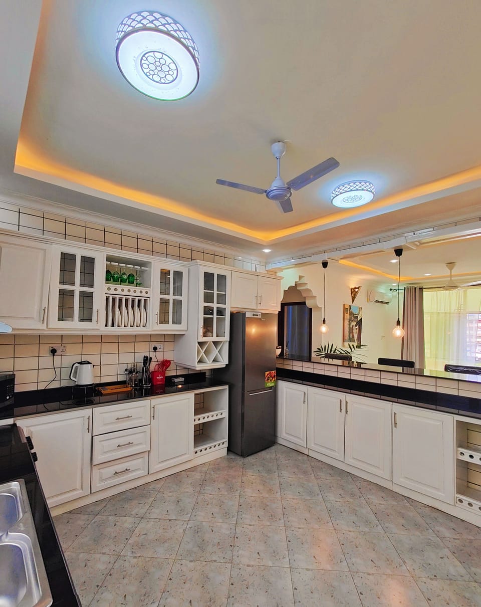 Deluxe Apartment, 3 Bedrooms, City View | Private kitchen | Full-size fridge, microwave, oven, dishwasher
