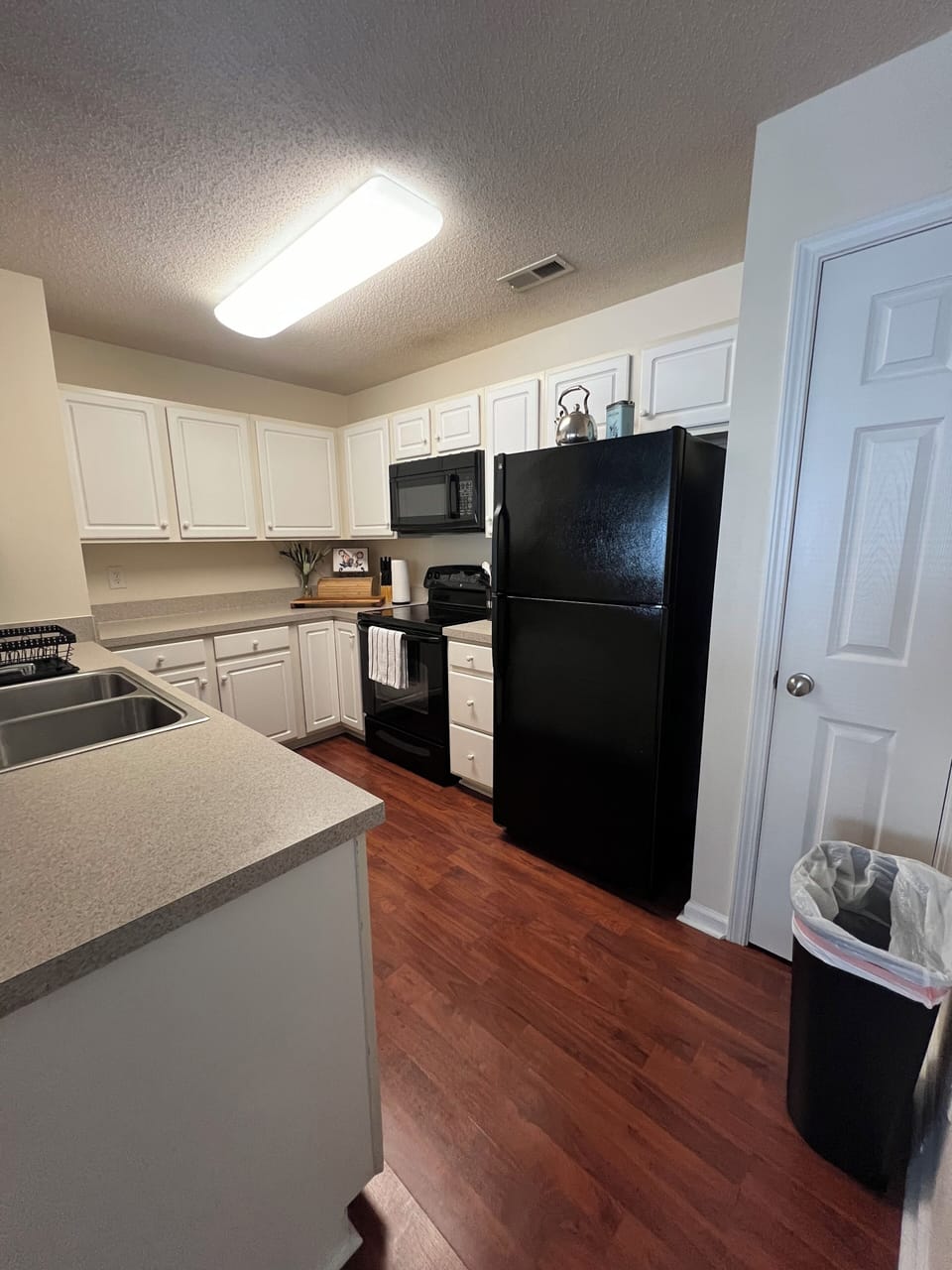 This fully equipped kitchen includes a pantry, garbage disposal, & dishwasher.