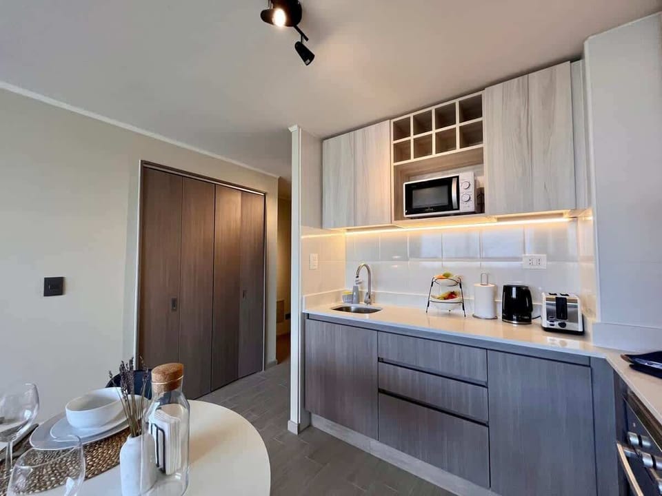Modern kitchen & dining nook w/ built-in shelving