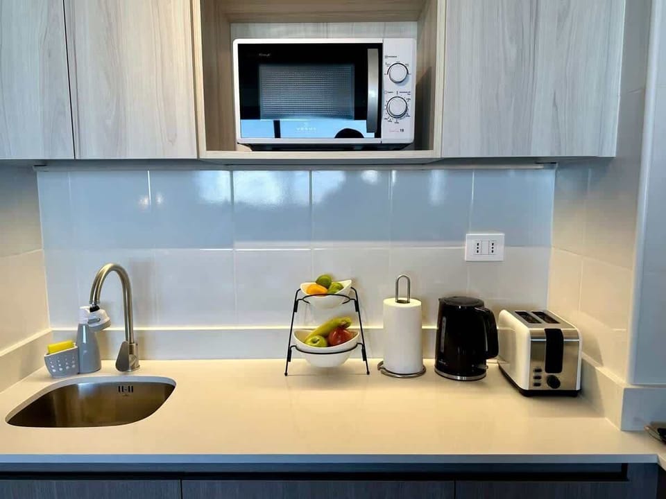 Functional kitchenette w/ microwave, sink & coffee maker