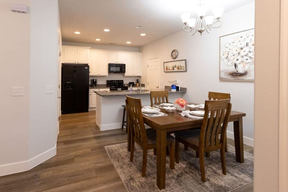 Beautiful and impeccably clean dining area and kitchen with bar seating.