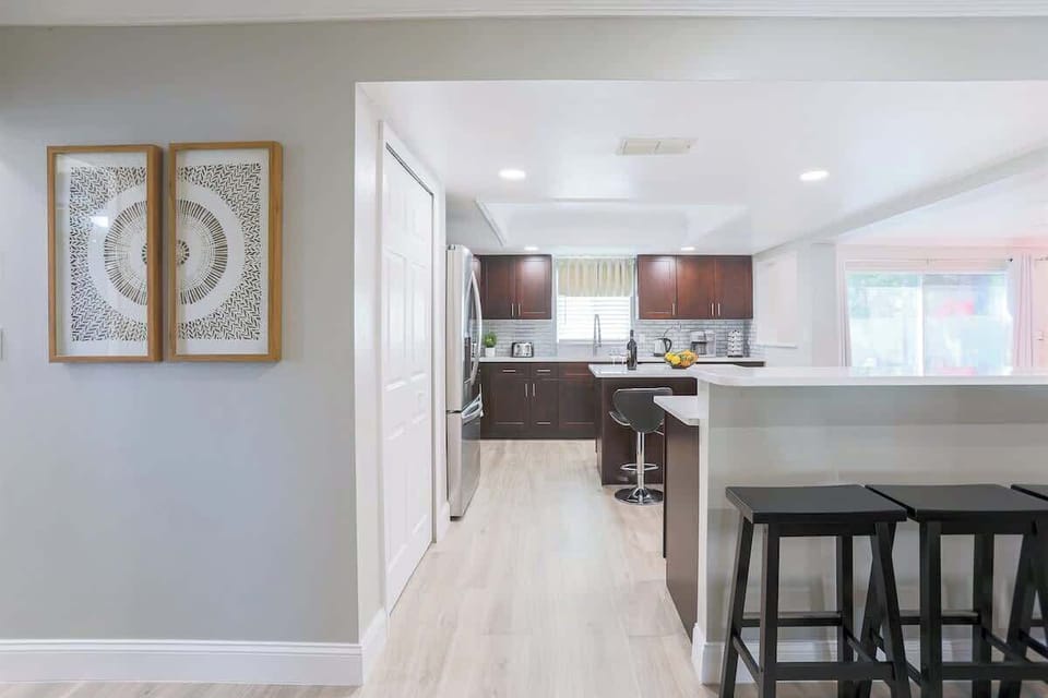 In Pondside Funhouse, our vacation rental home in Pinellas Park, Florida, experience an open-concept kitchen fully furnished with state-of-the-art appliances.