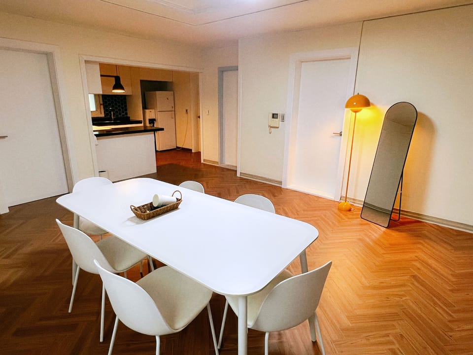 Family Studio Suite | Living area | 23-inch flat-screen TV with cable channels, heated floors