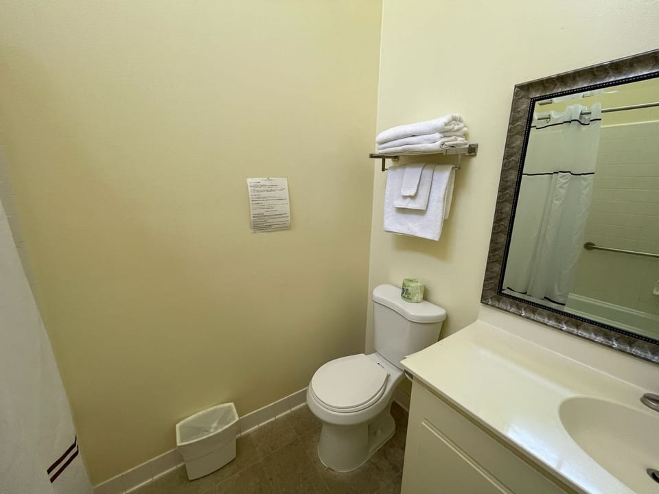 Combined shower/tub, rainfall showerhead, towels, soap