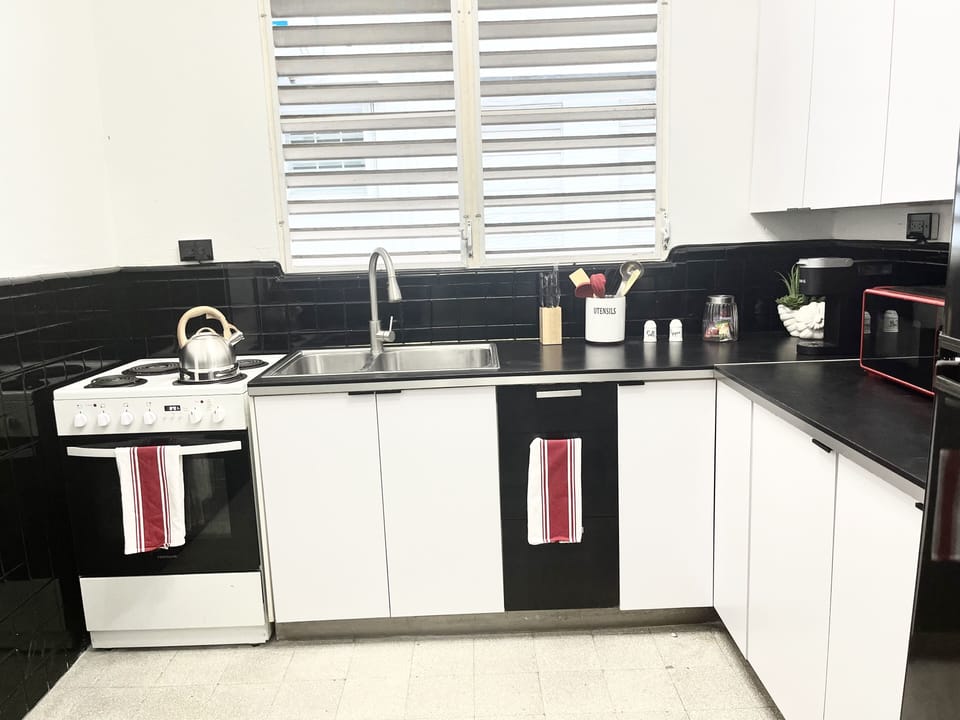 Full kitchen (no dishwasher) also has tea kettle.
