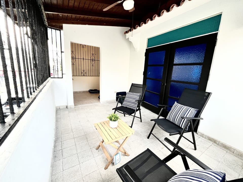 Front balcony with three lounge chairs, toys and yoga/meditation room.