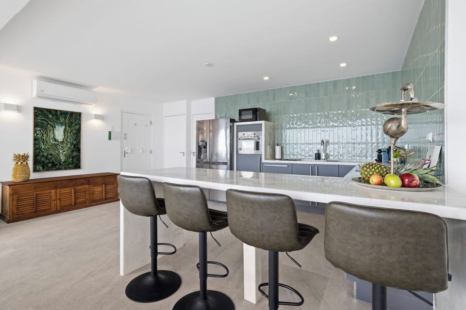 open modern kitchen with marble counter tops 