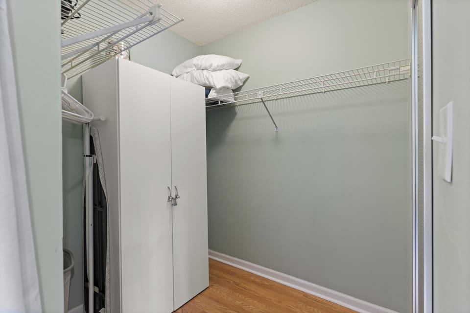 The primary bedroom has a large walk-in closet, big enough for a pack n play 